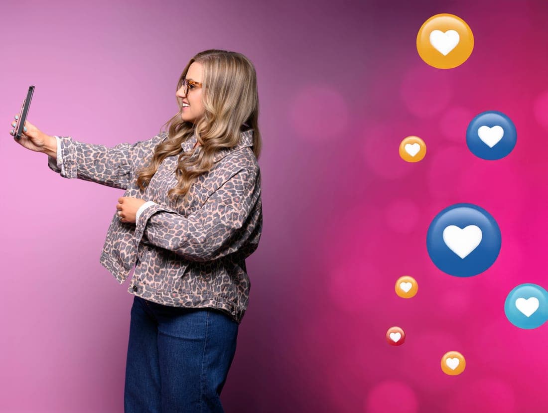Jen on a pink backdrop surrounded by floating social media reactions like hearts and likes